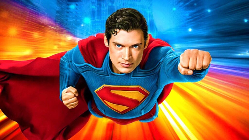 David Corenswet como o novo Superman, voando em alta velocidade em direção à câmera com uma expressão determinada, vestindo o traje azul e vermelho com o emblema 'S' no peito.